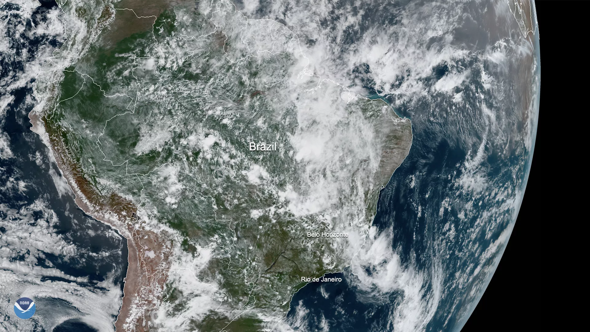 White clouds of large storm system seen over Brazil.